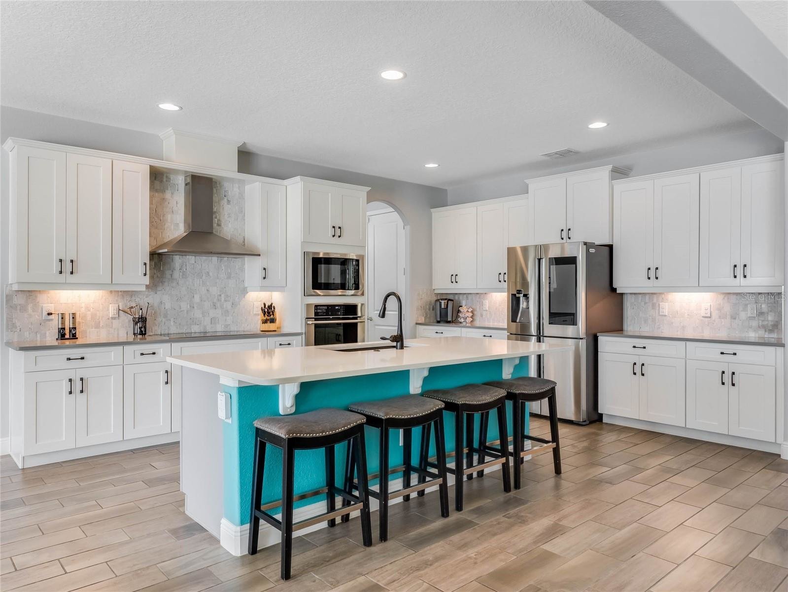 kitchen with white cabinets and stainless steel appliances